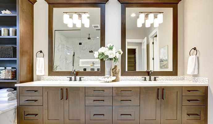 Modern bathroom vanity cabinet with sink and storage drawers.