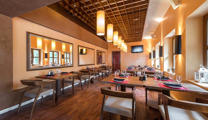 Elegant restaurant interior design with beautifully arranged tables and stylish chairs