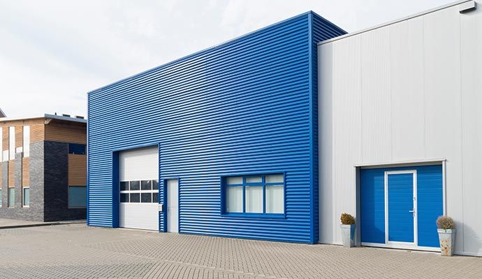 Freshly painted warehouse exterior with clean modern finish and durable coating