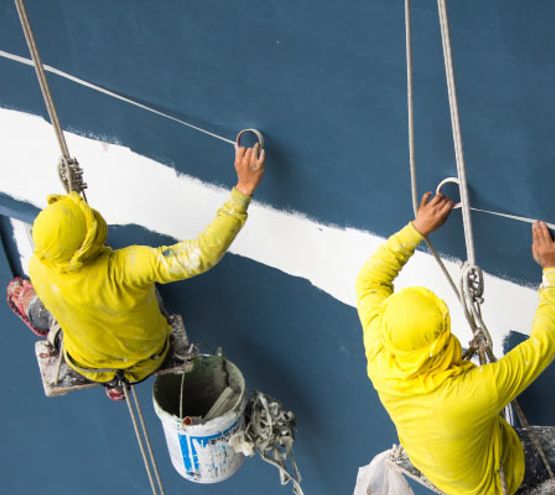 A team of experts painting commercial building