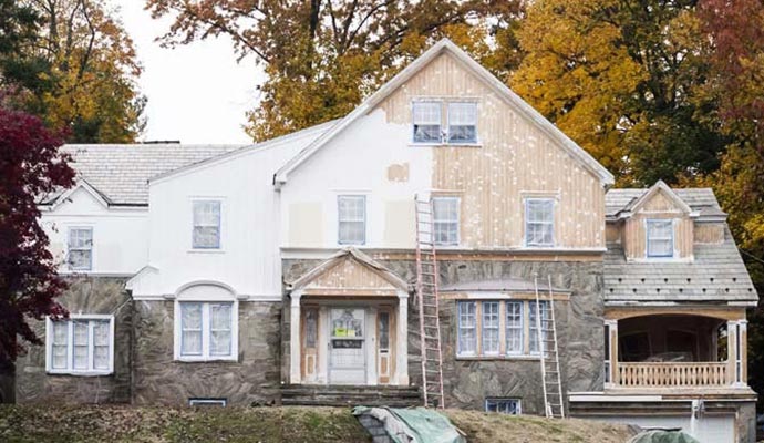 Professional exterior painting services transforming a house's appearance