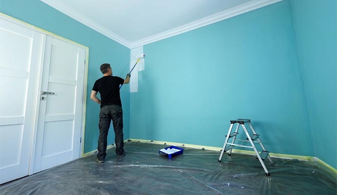 An Expert painter painting interior of a home