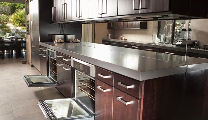 A modern kitchen featuring dark wood cabinets